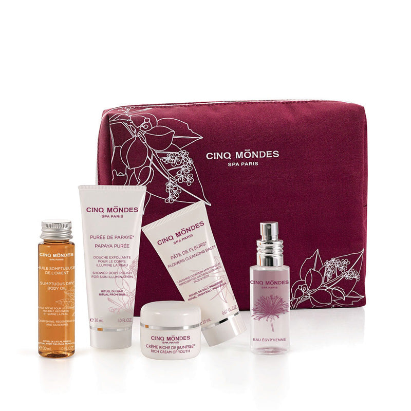cinq mondes 5 iconic products in a stylish, reusable travel pouch, provides an assortment of essential skincare and bodycare